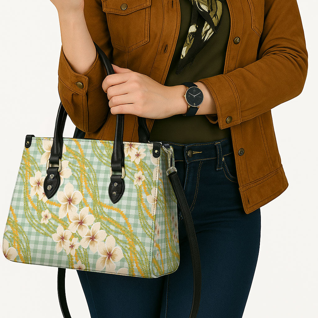 Liko Kukui Hawai'i Palaka Plumeria Leather Bag Puakenikeni and Maile Lei